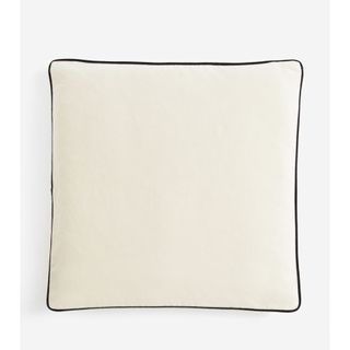 cream velvet pillow with a black border