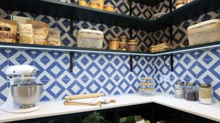 blue and white diamond wall tiles in kitchen pantry