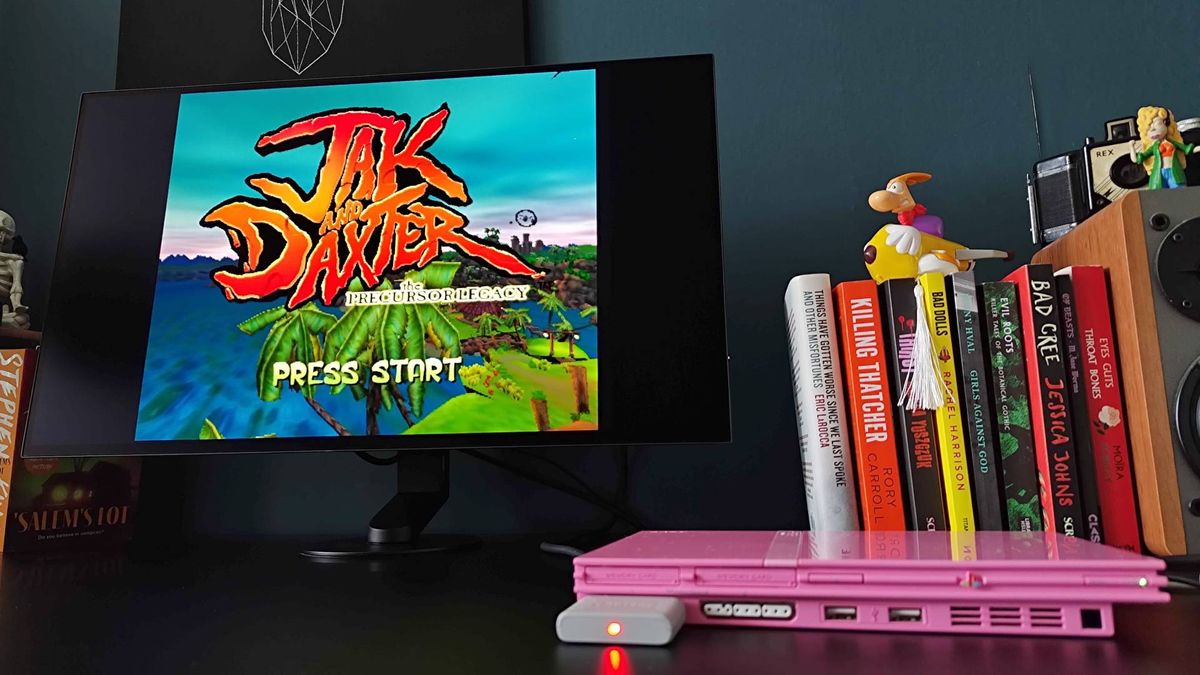 Sony Inzone M10S II with pink PS2 slim connected and Jak and Daxter start screen displayed with squashed aspect ratio.