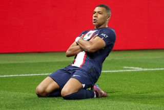 Kylian Mbappe of PSG celebrates his goal on a penalty kick during the UEFA Champions League group H match between Paris Saint-Germain (PSG) and SL Benfica at Parc des Princes stadium on October 11, 2022 in Paris, France.