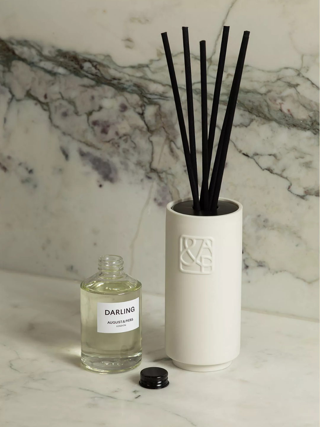 A white ceramic reed diffuser