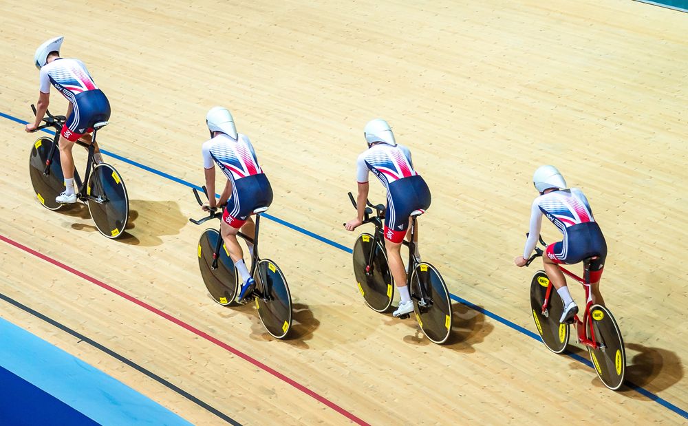 Members of the men's team emerge onto the track