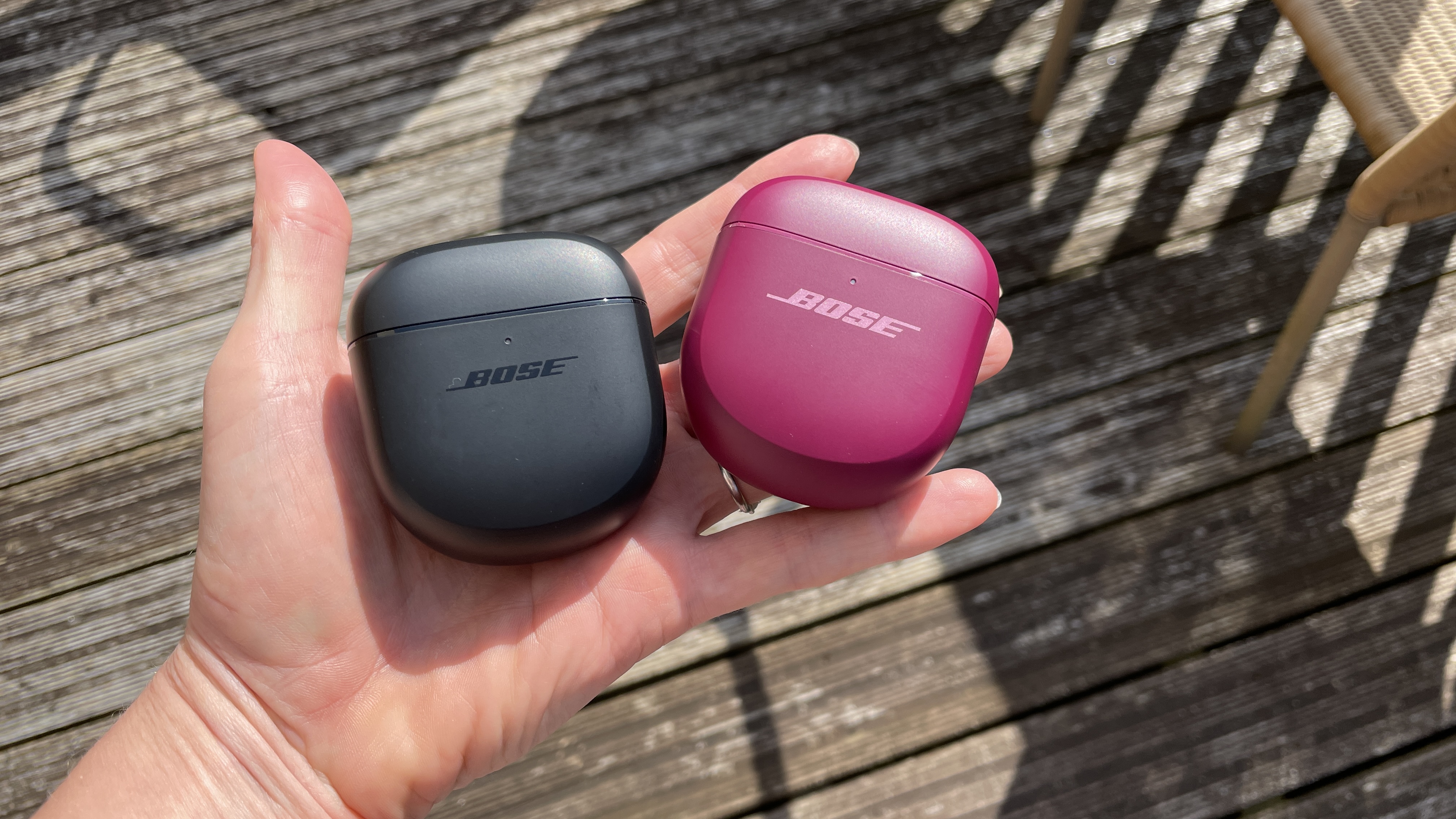The QCUE and QCUE 2 next to each other, outside on a sunny day, showing their similarities 