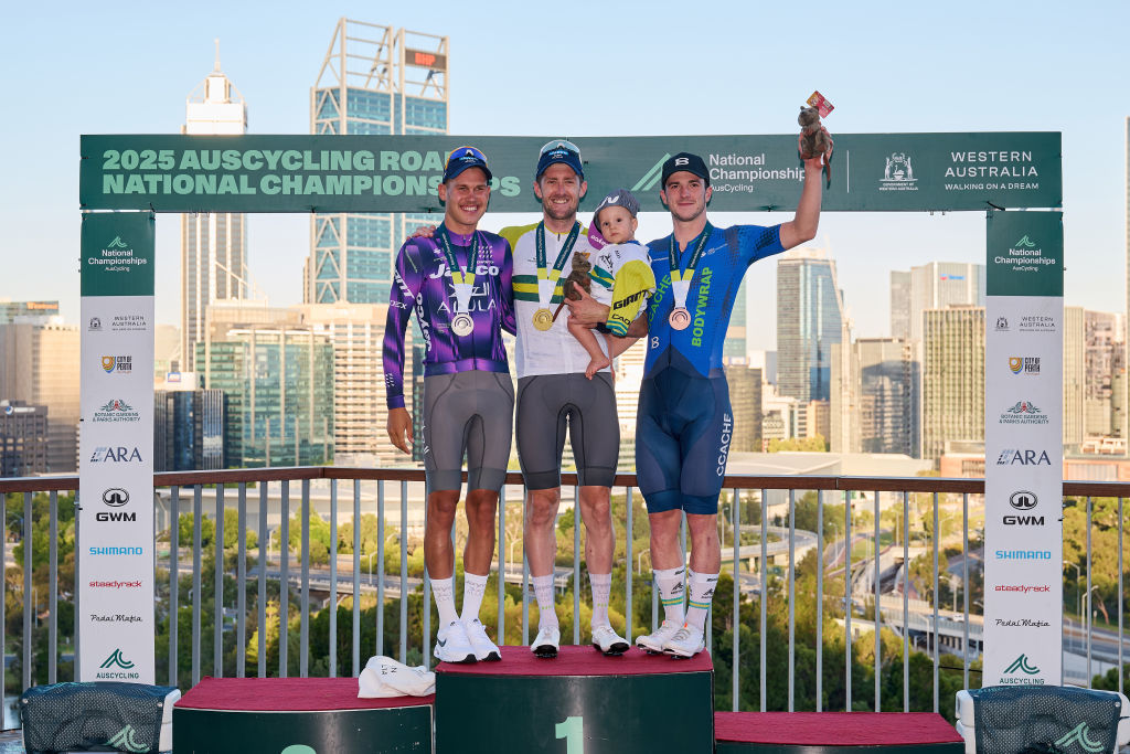 PERTH AUSTRALIA JANUARY 12 Lucas Plapp of team Jayco Alula Luke Durbridge of team Jayco Alula his son Henry Durbridge and Liam Walsh of team CCACHE x BODYWRAP on the podium after winning the Mens Elite Road Race as part of the 2025 Road Nats on January 12 2025 in Perth Australia Photo by Stefan GosattiGetty Images