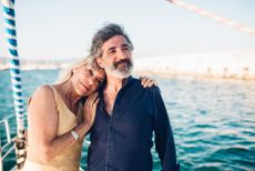 Portrait of a senior couple enjoying cruising on their yacht.