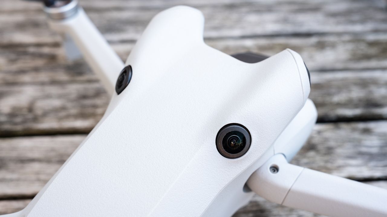 close-up view of two camera lenses on the grey body of a drone.
