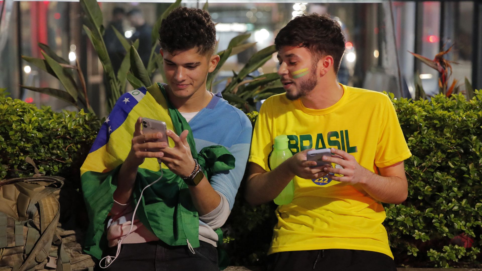 Supporters of Brazilian President and re-election candidate Jair Bolsonaro react during the vote count of the legislative and presidential election, in Sao Paulo, Brazil, on October 2, 2022.