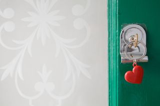 green door with a key and heart keychain