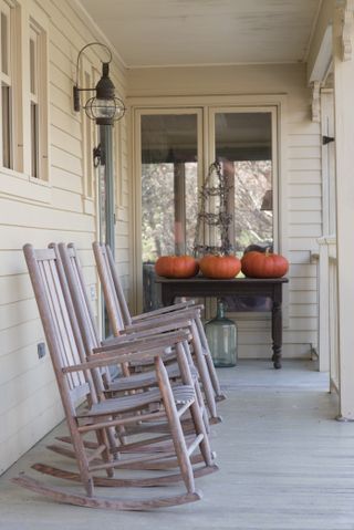 rocking chairs on porch in New England farmhouse