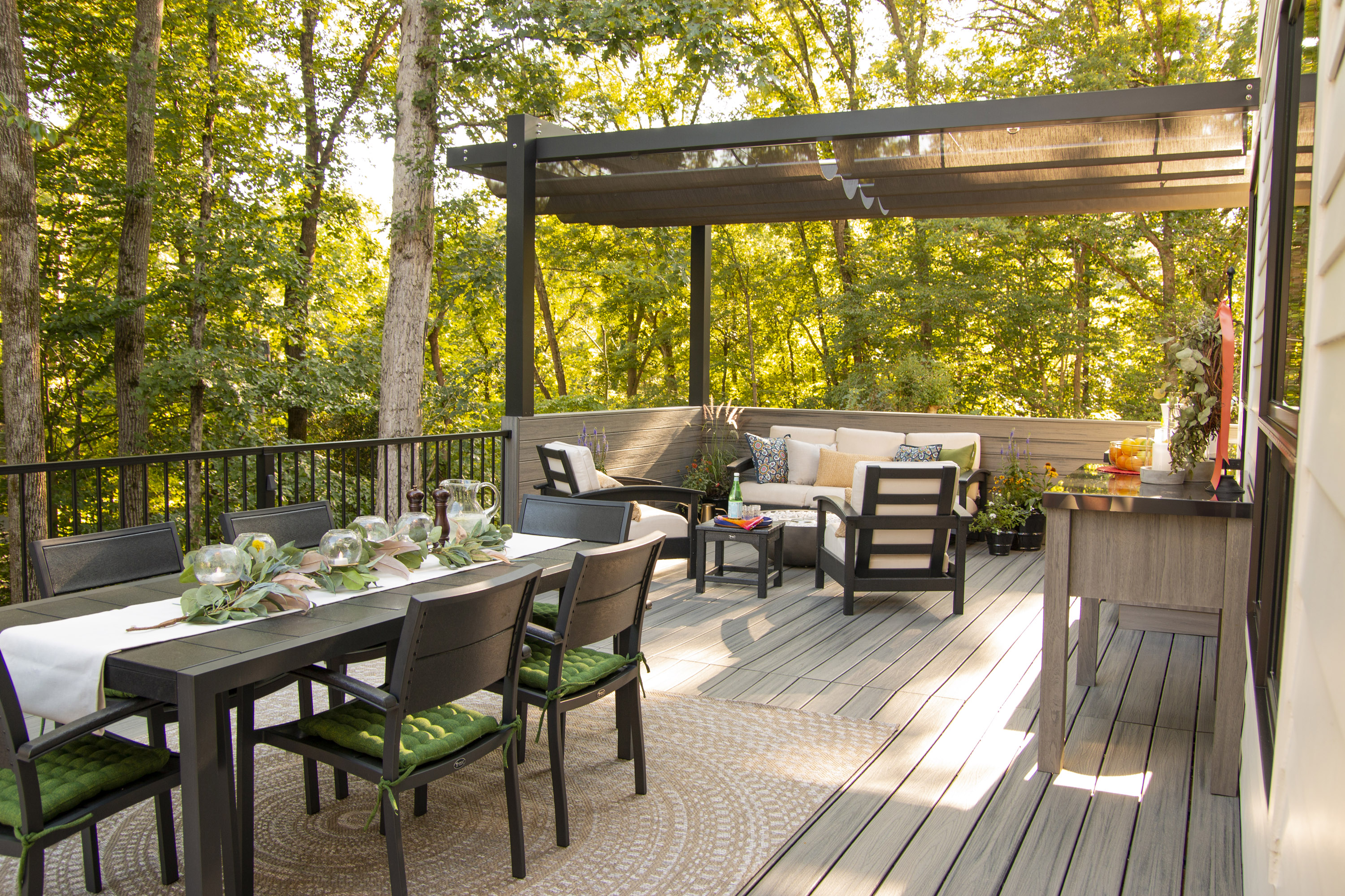 Low maintenance garden ideas: decking area with composite decking, a dining area and seating area