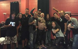 Anthrax and their crew backstage with Norman Reedus
