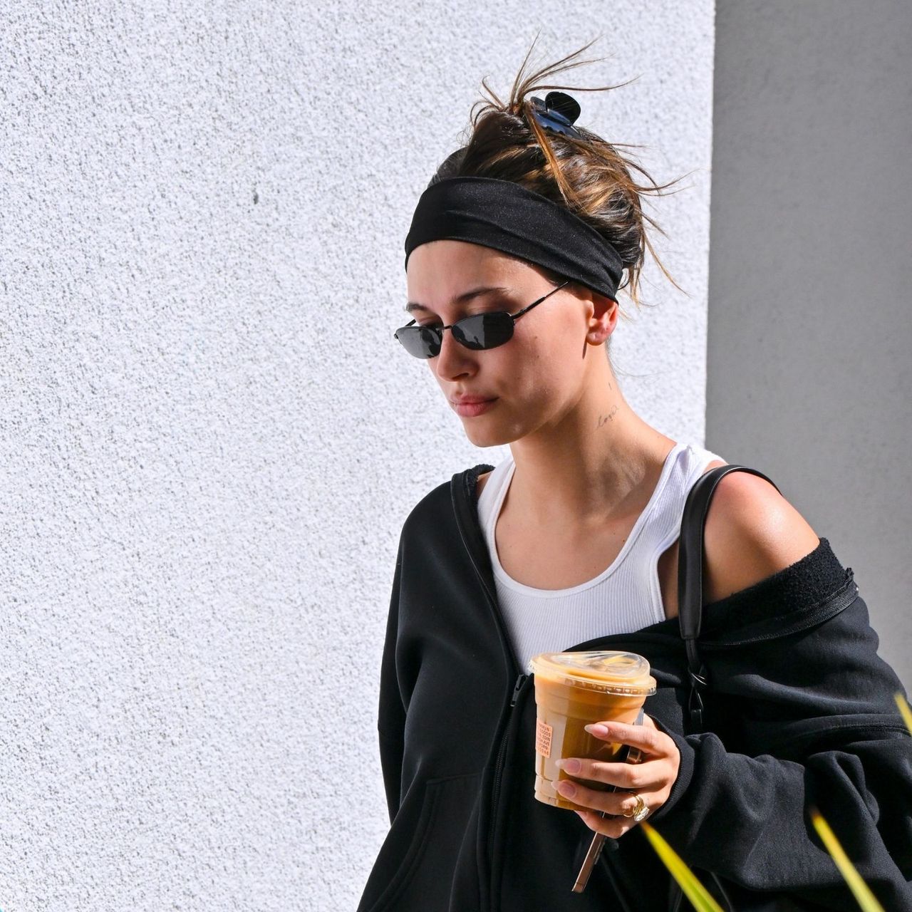 Hailey Bieber Knows This Sneaker Color Trend Looks Best With Black Leggings