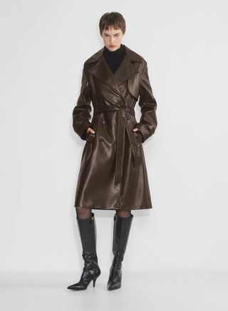 Aritzia model wearing brown leather trench coat