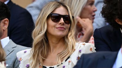 Sienna Miller looks on from the royal box ahead of the Ladies' quarter-final match between Aryna Sabalenka and Laura Siegemund of Germany on day nine of The Championships Wimbledon 2025 at All England Lawn Tennis and Croquet Club on July 08, 2025 in London, England