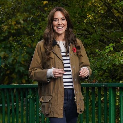 Kate Middleon wears a Breton stripe sweater and a Barbour rain jacket.