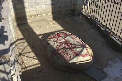 The vandalized Plymouth Rock.