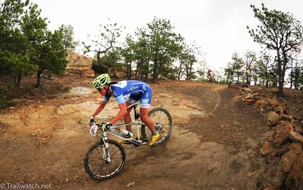Katerina Nash (Luna Pro Team) descending a slick course during a rainstorm