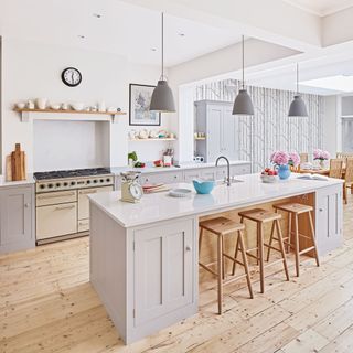 white kitchen with worktop and wooden floor