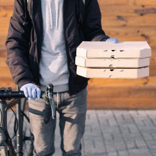 delivery man with cycle and parcel