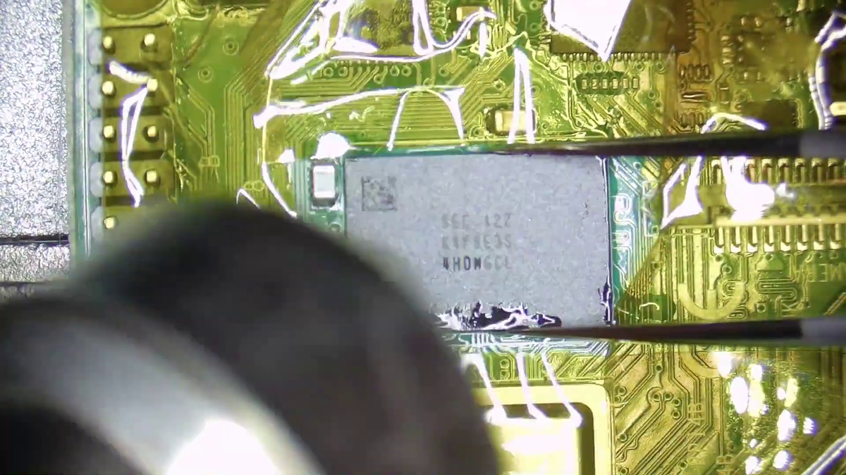 Replacing the 1GB RAM chip on a Raspberry Pi 4 with an 8GB RAM chip.