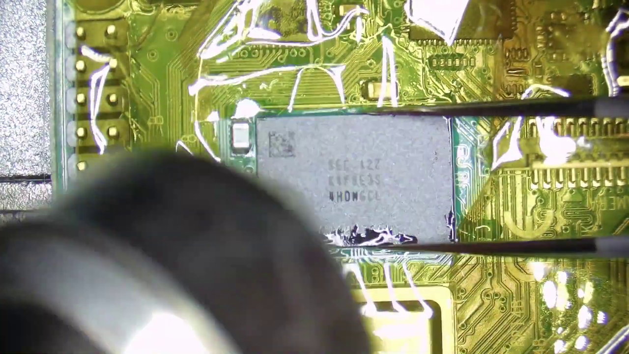 Replacing the 1GB RAM chip on a Raspberry Pi 4 with an 8GB RAM chip.