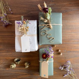 Gift wrap kit with presents, dried flowers, bells