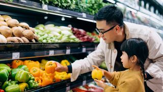 Man and daughter at supermarket