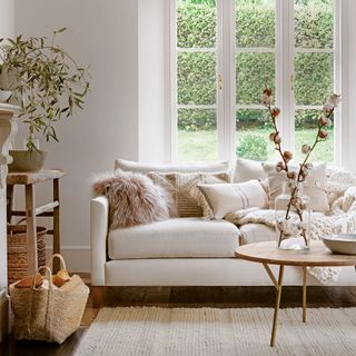 White living room with textured cushions