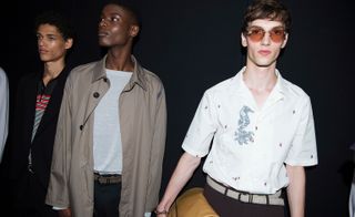 Males models wearing beige jackets and white shirts from the Salvatore Ferragamo S/S 2018 collection