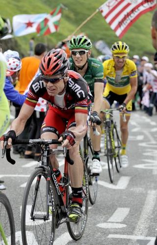 BMC rider Cadel Evans leads yellow jersey Voeckler in the final few kilometres.the