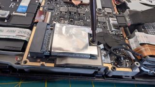 Upgrading Steam Deck SSD: Unscrew SSD.