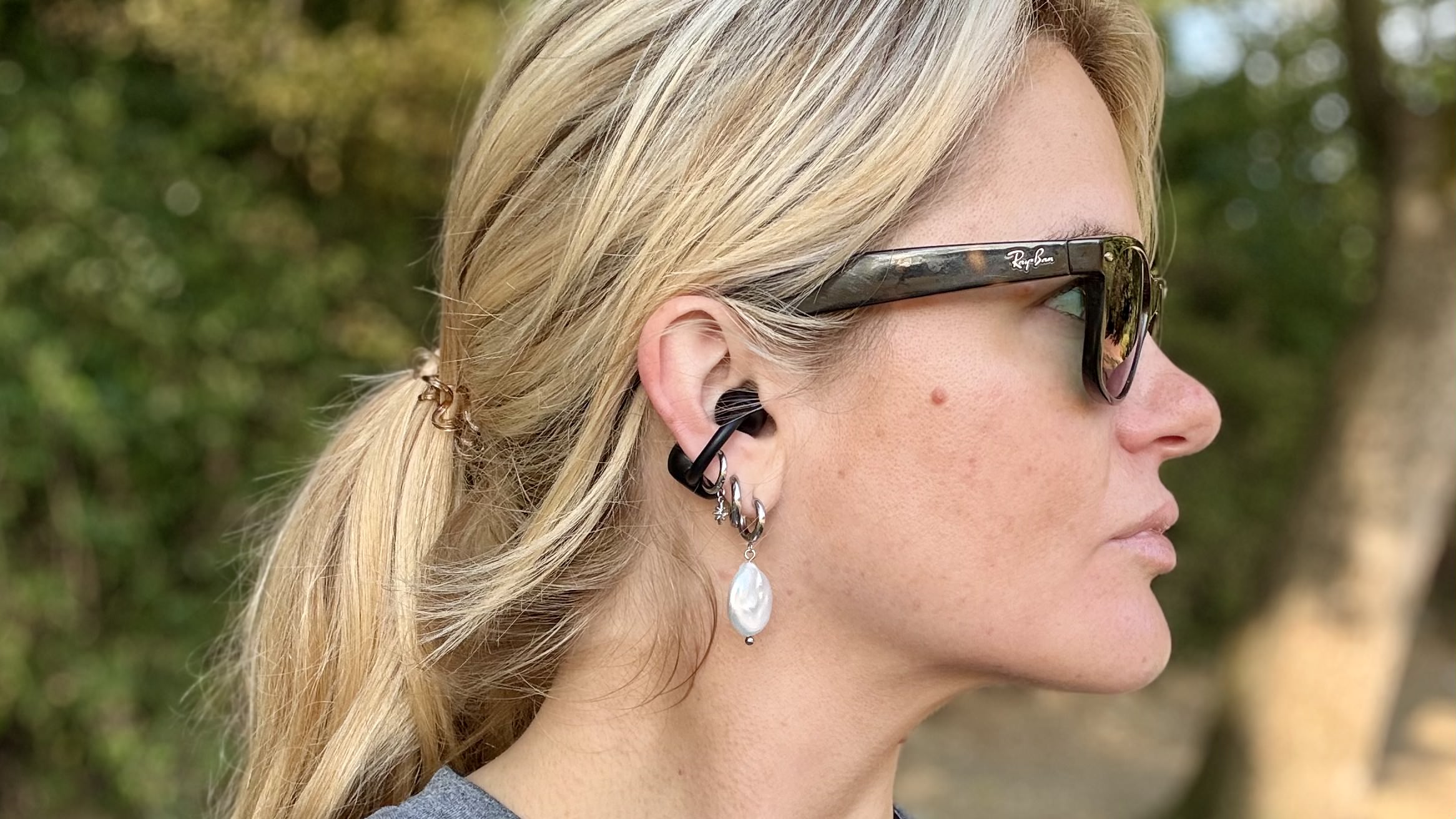 Becca Caddy side profile wearing Tozo earbuds