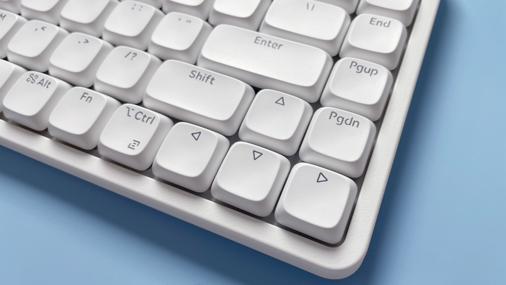 The Lofree Flow Lite mechanical keyboard against a blue background.