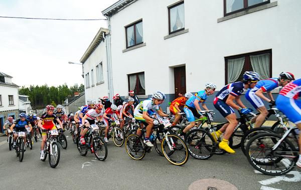 Junior riders on the steep road climb