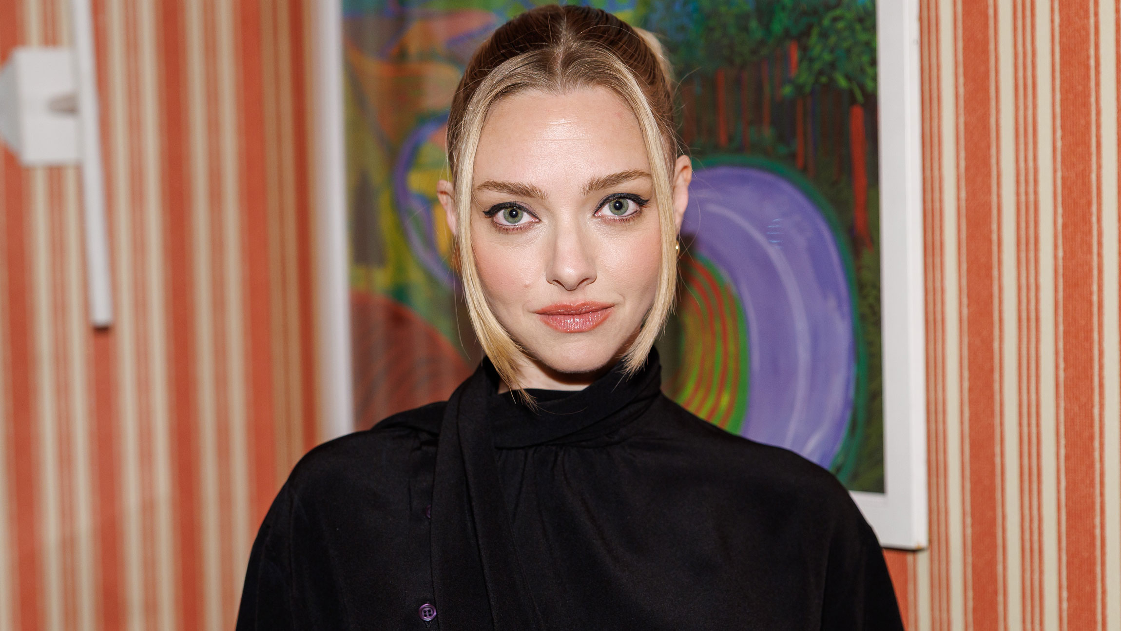 Amanda Seyfried wears a black jacket