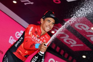 LAVARONE ITALY MAY 25 Santiago Buitrago Sanchez of Colombia and Team Bahrain Victorious celebrates winning the stage on the podium ceremony after the 105th Giro dItalia 2022 Stage 17 a 168 km stage from Ponte di Legno to Lavarone 1161m Giro WorldTour on May 25 2022 in Lavarone Italy Photo by Tim de WaeleGetty Images