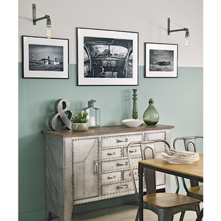 dining room with green wall and dining table