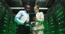 Woman and man in a server room
