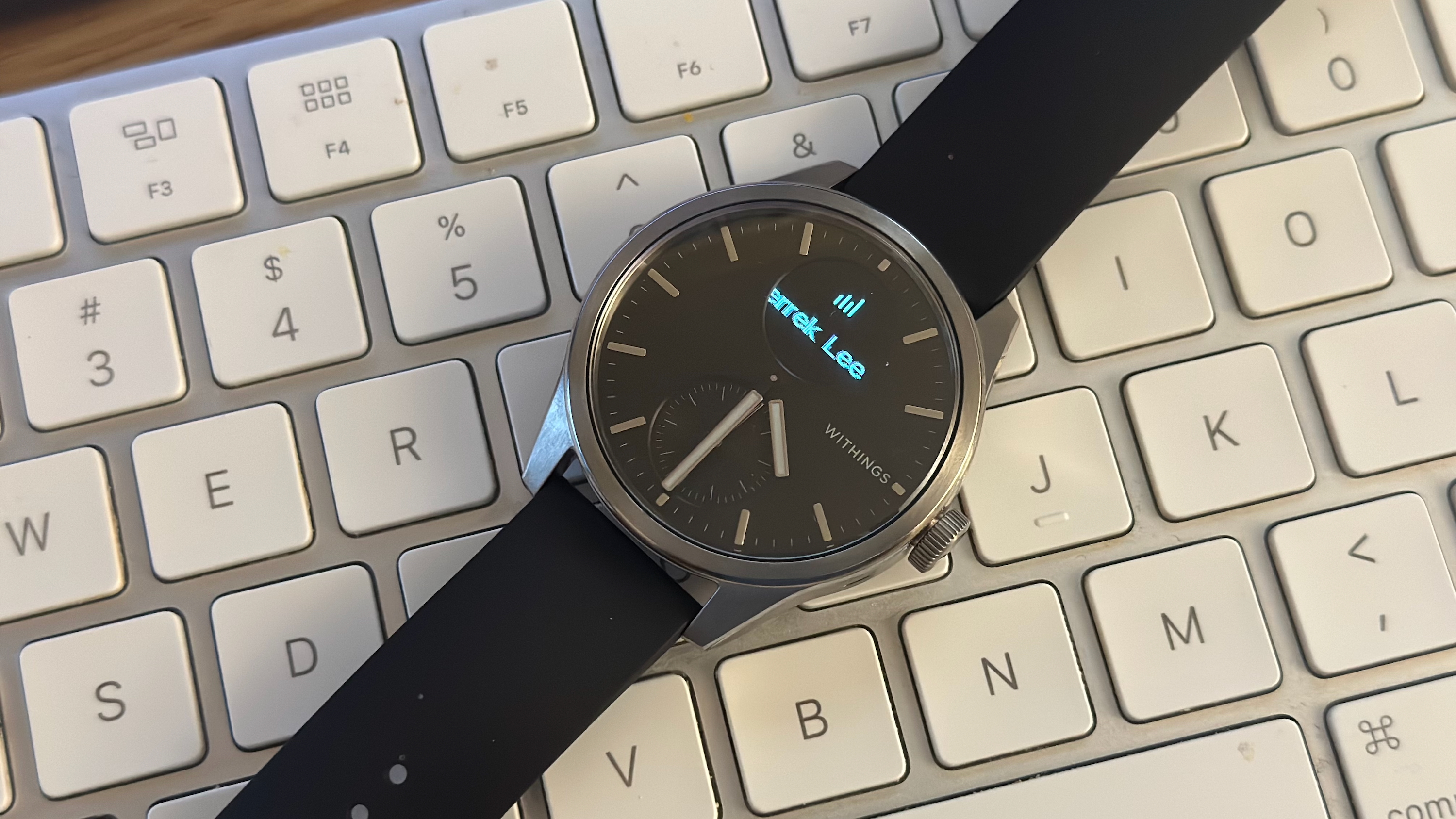 The Withings ScanWatch 2 showing a fraction of a Slack notification, the sender 