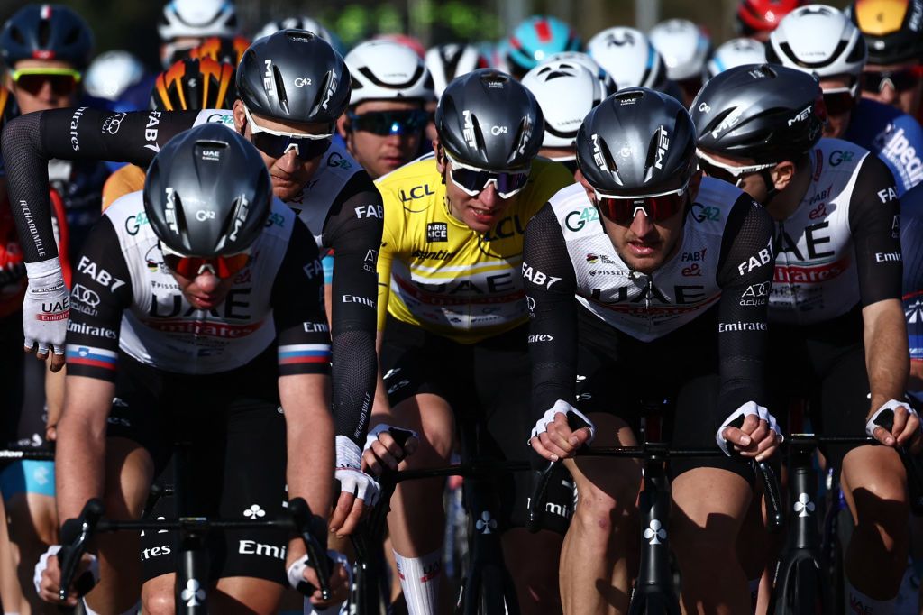 UAE Team Emirates riders including UAE Team Emirates Slovenian rider Domen Novak L and UAE Team Emirates Slovenian rider Tadej Pogacar C wearing the overall leaders yellow jersey cycle with the pack during the 5th stage of the 81st Paris Nice cycling race 2125 km between SaintSymphoriensurCoise and SaintPaulTroisChateaux southeastern France on March 9 2023 Photo by AnneChristine POUJOULAT AFP Photo by ANNECHRISTINE POUJOULATAFP via Getty Images