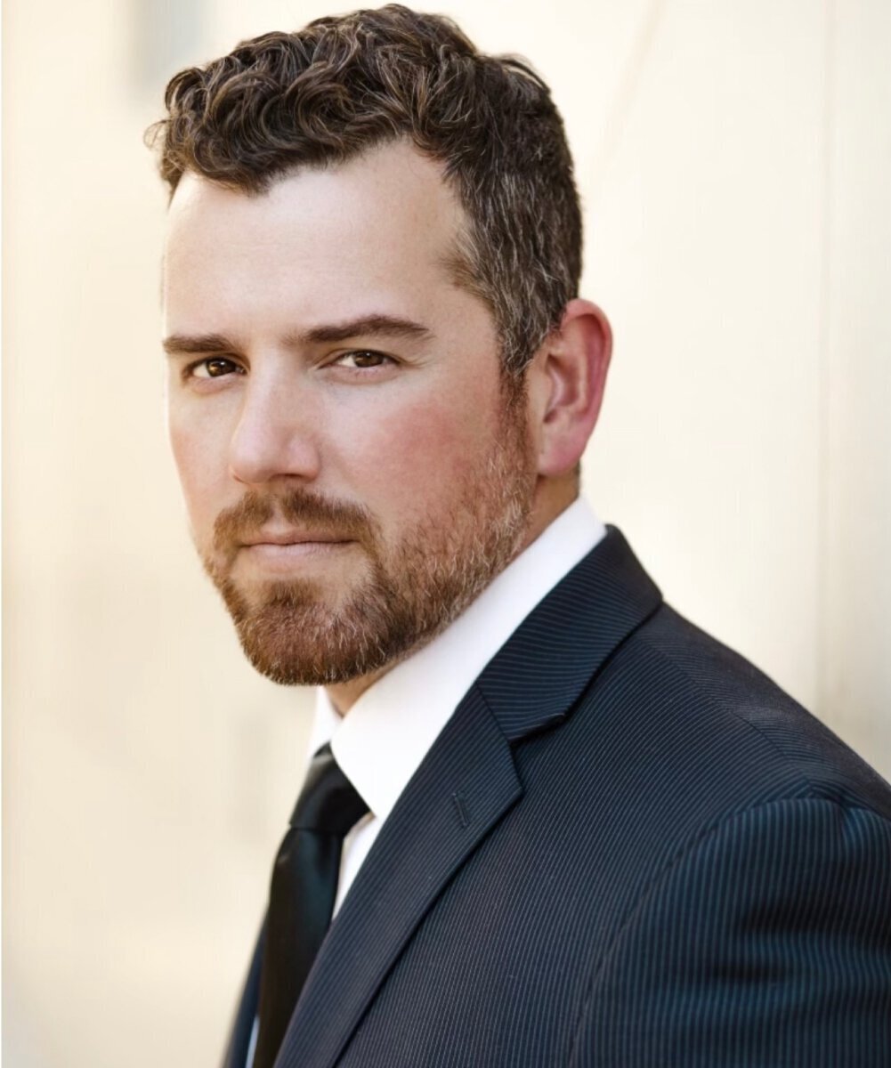 Dr. Daniel Gould in a gray suit