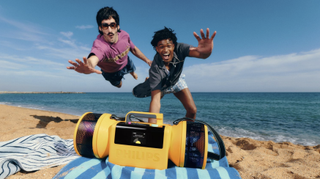 Philips audio products worn by a group of young people, with a skateboard