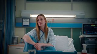 Jac Naylor in a hospital gown in Holby City