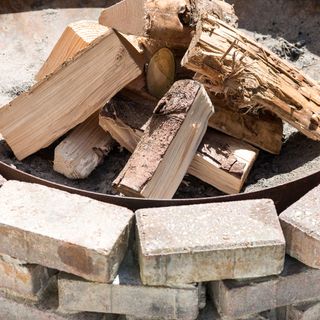 fire wood with bricked fire pit