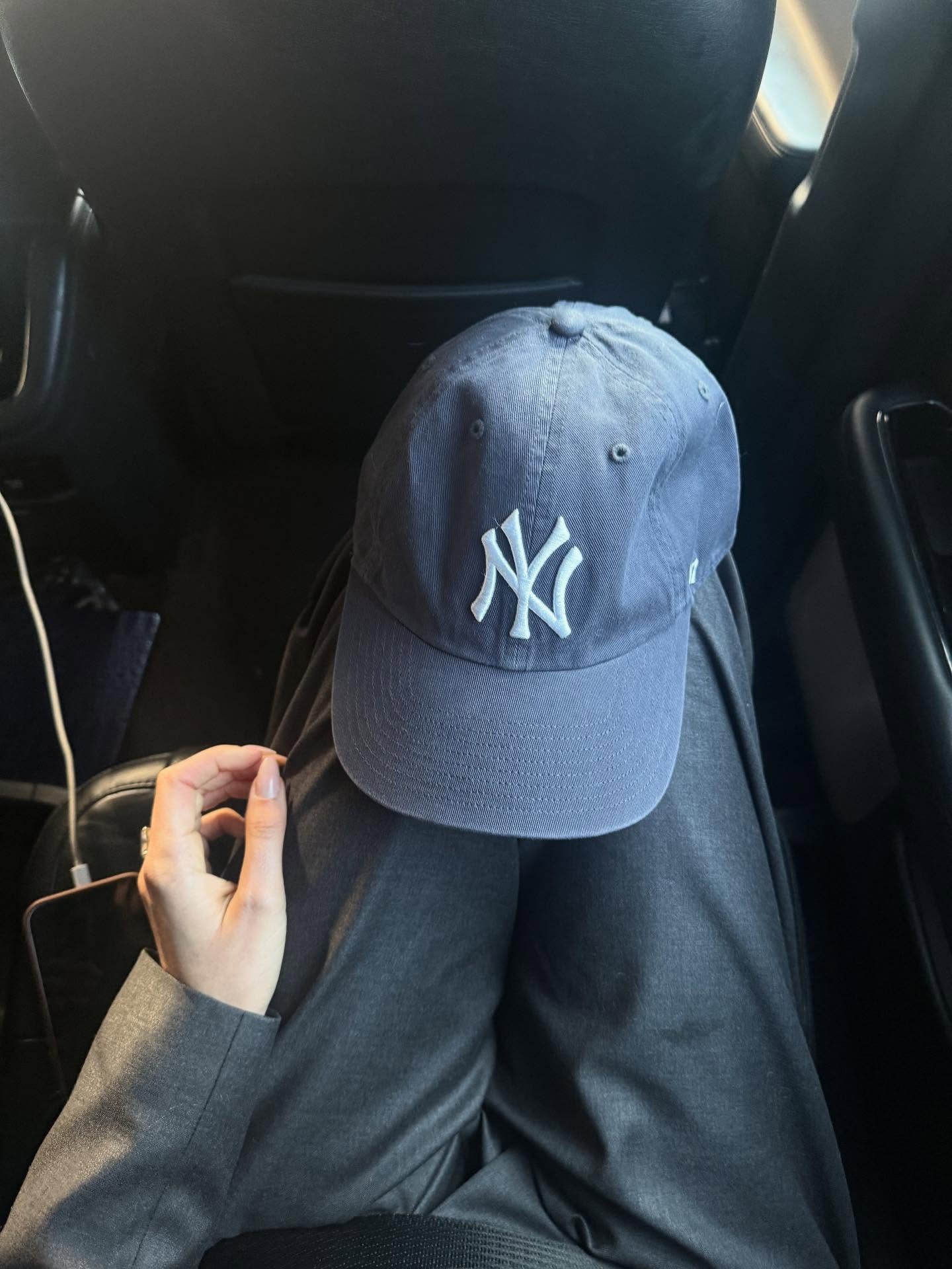 NY Yankees baseball cap.