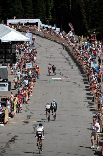 Fans wait for riders as they trickle in to the finish.