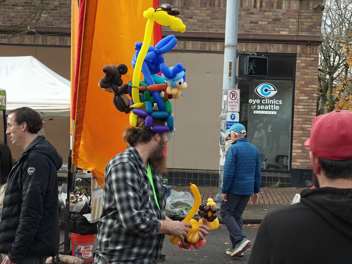 A man with balloons on his head