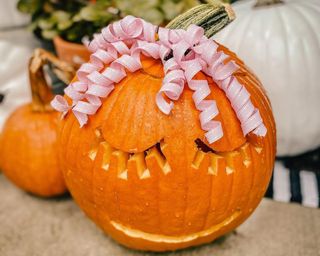 A carved pumpkin idea with carved 'eyelashes'
