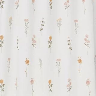A shower curtain with flowers on it