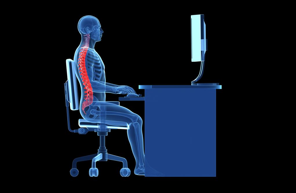 An artist&#039;s image shows the form of a human body sitting with proper posture at a desk.